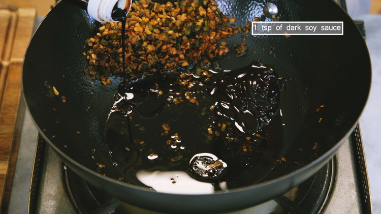 Image of Add 2 tbsp of soy sauce, 2 tbsp of oyster sauce, and 1 tsp of dark soy sauce. Stir over low heat for a minute or 2 to condense the sauce. Turn off the heat and let the sauce cool...