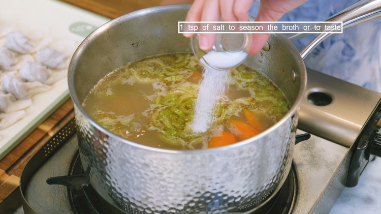 Image of The carrot and celery should be cooked to soft by now. Add some salt to taste.