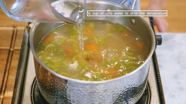 Image of Add the wontons and cook over medium heat for about 3 minutes. Then the water should come back to a boil. Add 1/2 cup of cold water and continue cooking for another 3 minutes. Adding cold water is a technique...