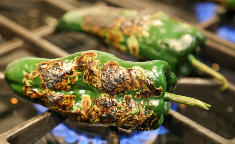 Image of Burn the poblano peppers. There are a number of ways...
