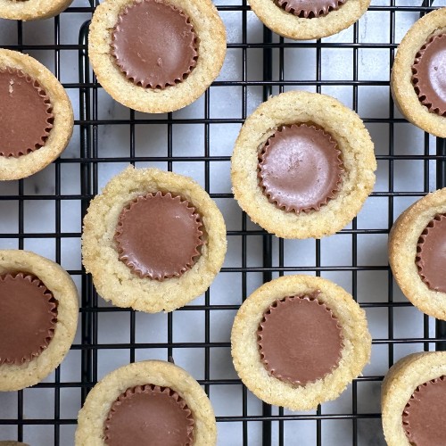 Sugar Cookie Peanut Butter Cups on a wire rack.