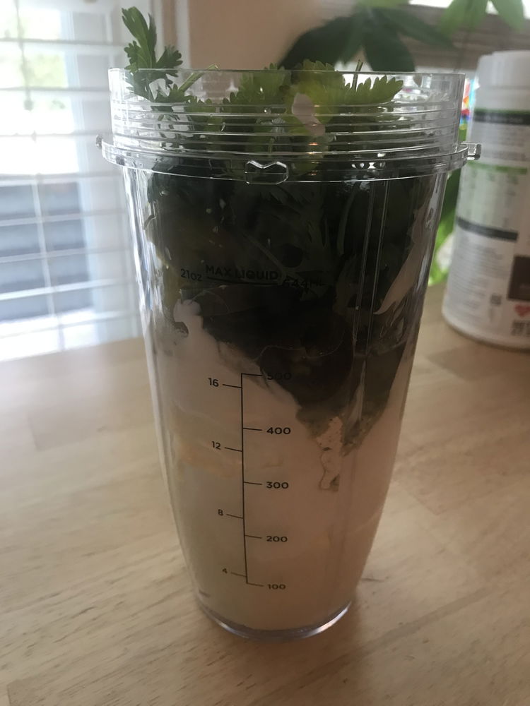 Image of Add all ingredients in a Ninja blending cup, a blender...