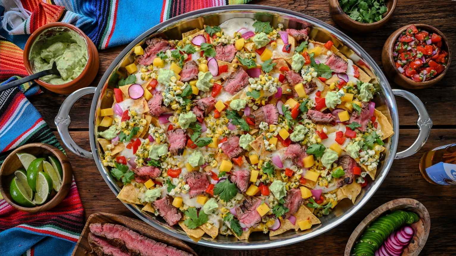 Image of Carne Asada Nachos with Elote Salsa & Oaxaca Fondue
