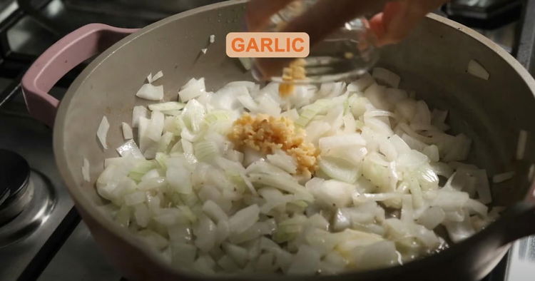 Image of Sauté Onion and Garlic: Add the diced onion to the...