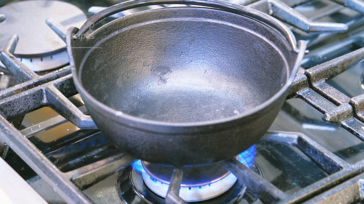 Image of This dish will be served in a small cast-iron pot or a heavy-duty skillet over a fondue set. Before stir-frying the beef, preheat the cast-iron pot over medium-low heat on a spare stove.