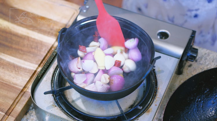 Image of Once the cast-iron pot is piping hot, add 2 teaspoons...
