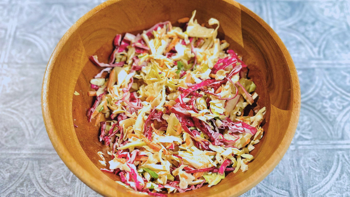 photo of coleslaw with bravado spice ghost pepper blueberry hot sauce