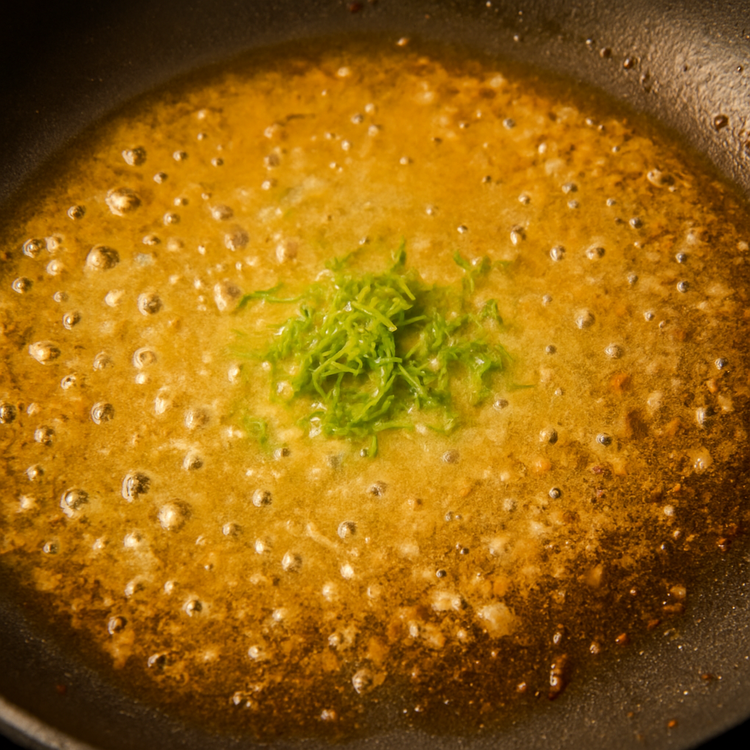 Image of Simmer until reduced by half and add the lime zest.