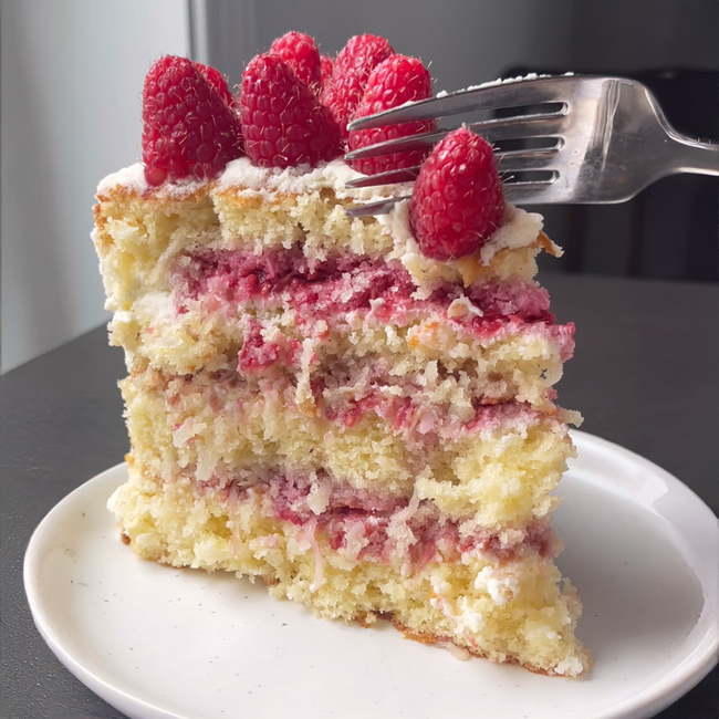 Image of Coconut Cake with Raspberry Filling and Mascarpone Whipped Cream