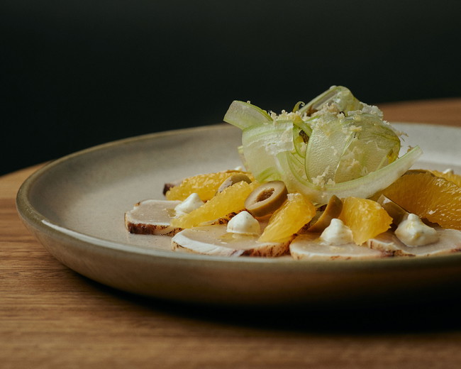 Image of torched kingfish cured in green olive brine, horseradish & cara cara orange