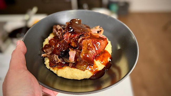 slow roasted and smoked lamb shoulder on a bed of mash with red wine jus