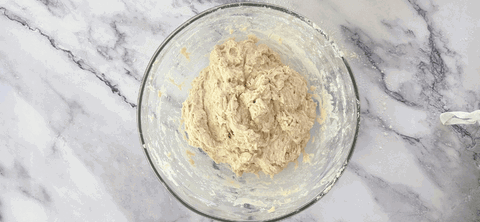 Image of The next morning, begin mixing your dough. In a bowl, combine levain, water and flour. Mix with your danish dough whisk until there are no dry spots left. Cover with plastic wrap or lid and leave to autolyse for approx....