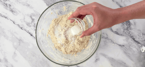 Image of Add your salt to the dough and pinch in with your fingers until incorporated.