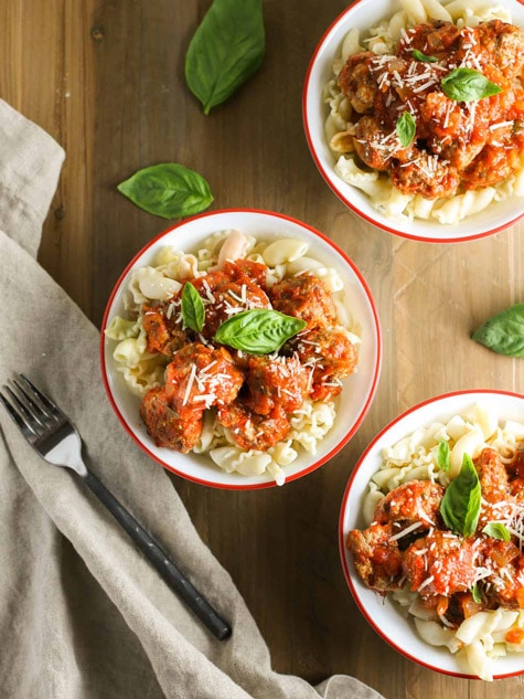 Mini Ricotta Meatballs with Herbed Tomato Suace| WorldofPastabilities.com | Moist, delicious, super simple recipe that they entire family will LOVE! Easy to freeze for later too!