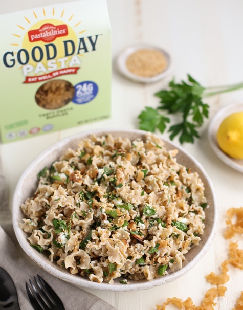 Toasted Nut and Feta Pasta in Bowl next to Good Day Pasta Box
