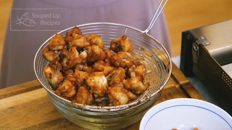 Image of Take the chicken out and set it aside. Pour the oil out of the wok. You can reuse it 3-4 times for other frying.