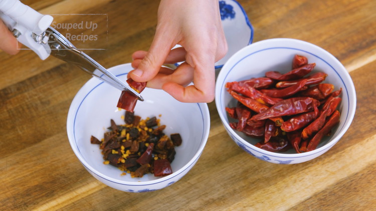 Image of Cut the spicy dried chilies and mild dried chilies into short pieces. You can play with the ratio to adjust the heat level based on your tolerance.  Don't be shocked by the chili amount; this is not that much compared...