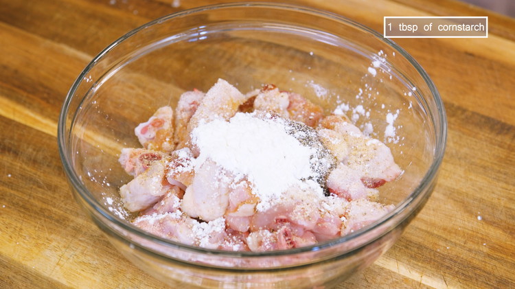 Image of Marinate the chicken with 1 Tbsp of soy sauce, 1 Tbsp of oyster sauce, 1/2 tsp of ground white pepper, 1/2 tsp of garlic powder, 1/2 tsp of sugar, and 1 Tbsp of cornstarch and mix thoroughly.