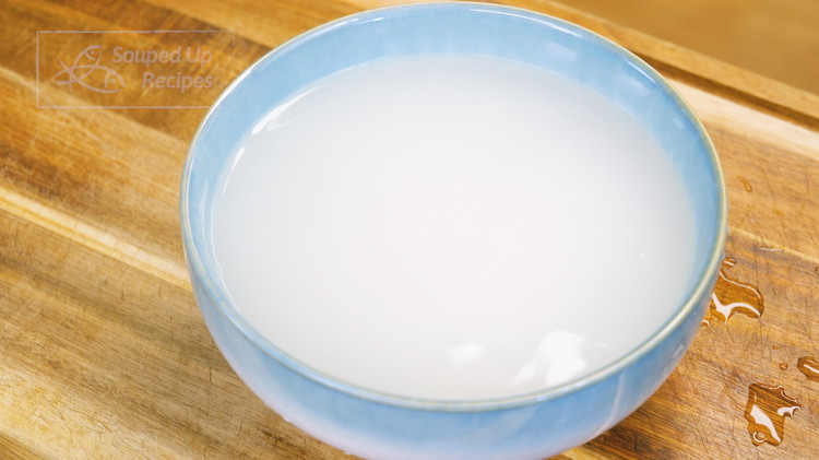 Image of Soak the glutinous rice in hot water for 1 hour. Don't use boiling-hot water because we don't want to cook the rice - Just as hot as your hands can tolerate. Fun fact - glutinous rice does not contain any...