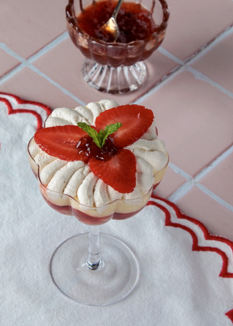 Image of Decorate with sliced strawberries and sprigs of mint.