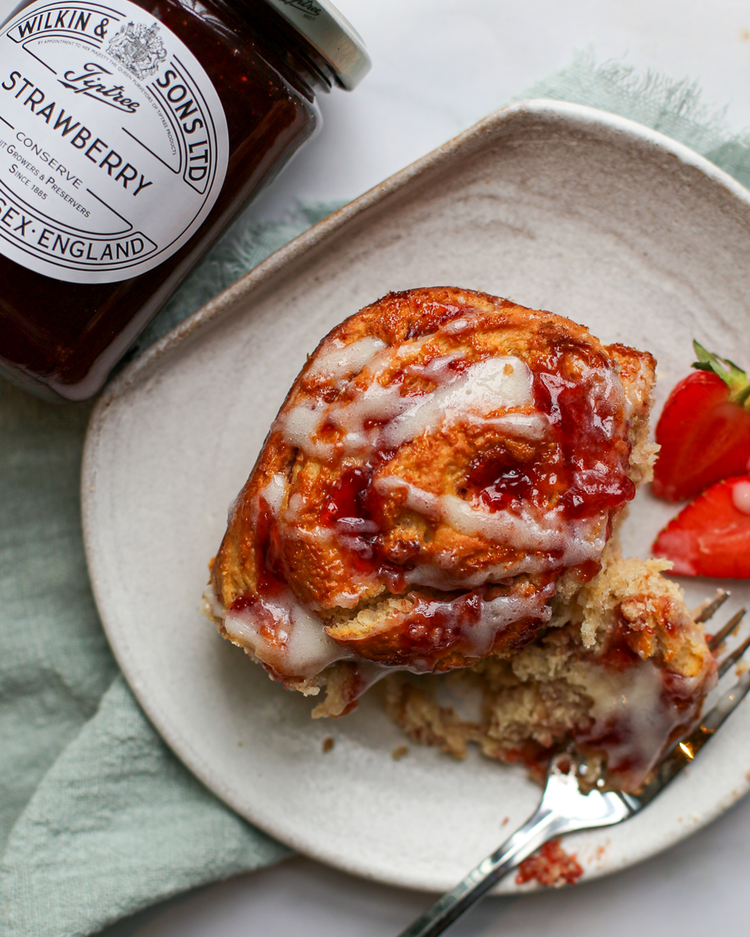 Image of Meanwhile, make the frosting. Using a stand mixer or an electric hand mixer, beat the ingredients together in a bowl until the frosting is combined and smooth. Pour over the warm rolls and serve.