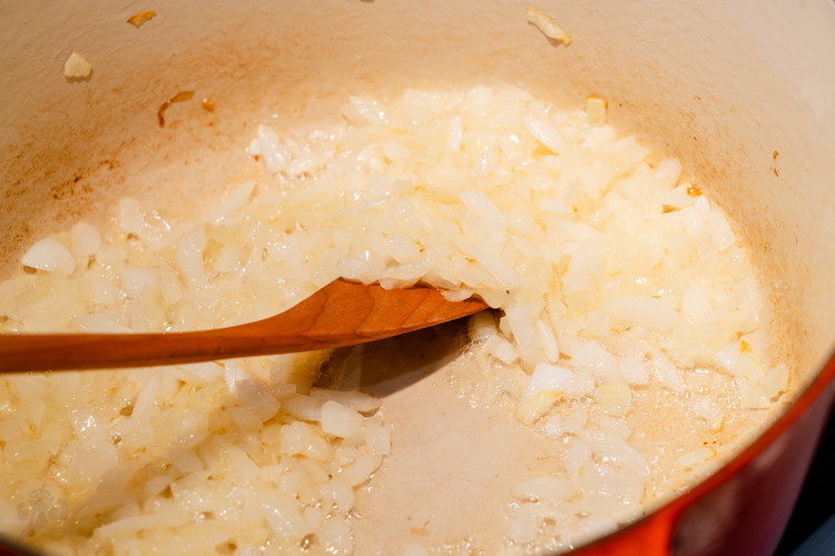 Image of Saute your diced onions over medium high heat until translucent and then add your marinated lamb directly to the onions in the pan.