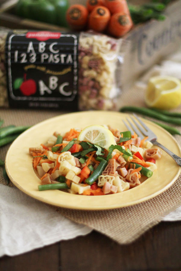 Fresh & Light Veggie Pasta Salad with Spicy Lemon Dressing | A light but flavorful dish featuring diced veggies and delicious pasta! Great with grilled meats or BBQ | WorldofPastabilities.com