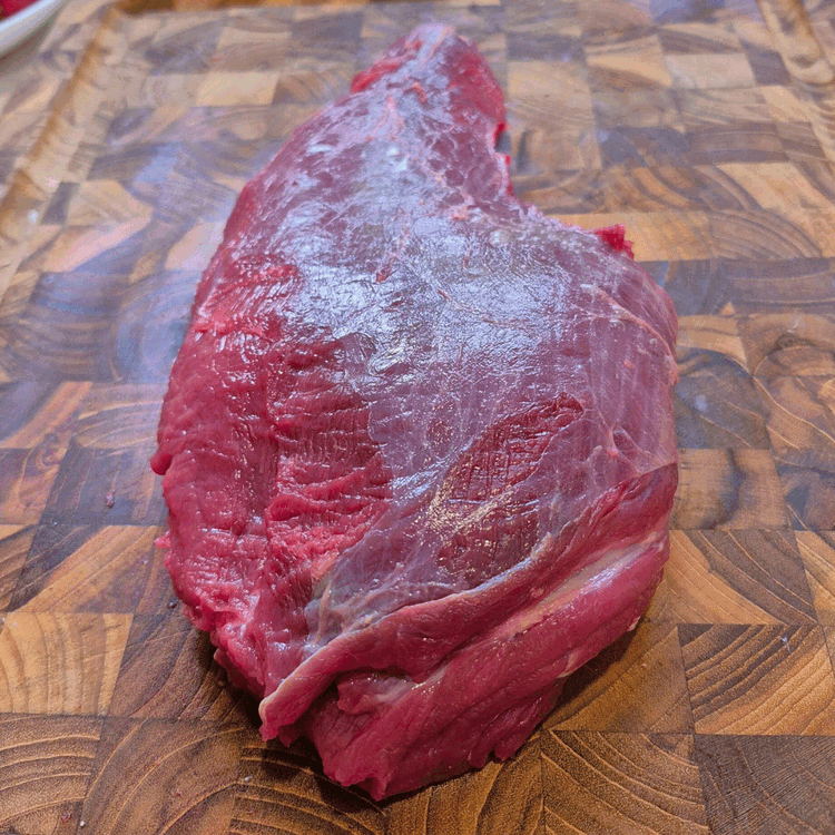 Image of Use a very sharp knife to trim any extra fat and silver skin from the tri-tip.