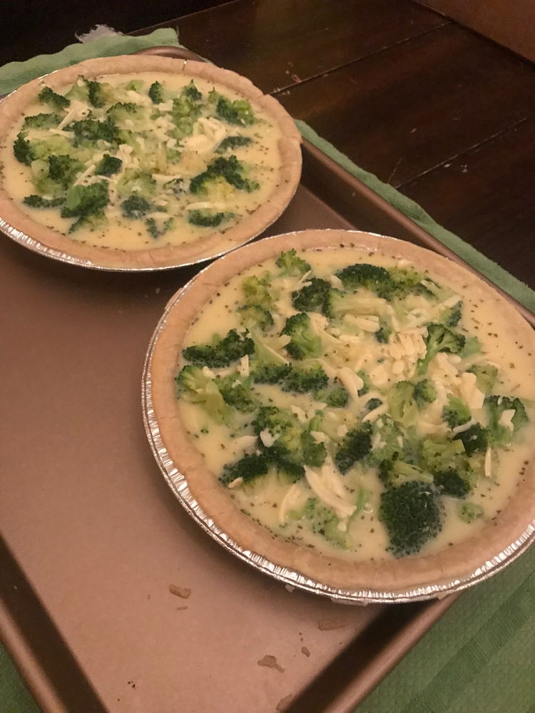Image of In the partially baked gluten-free pie crusts, transfer the egg/broccoli...