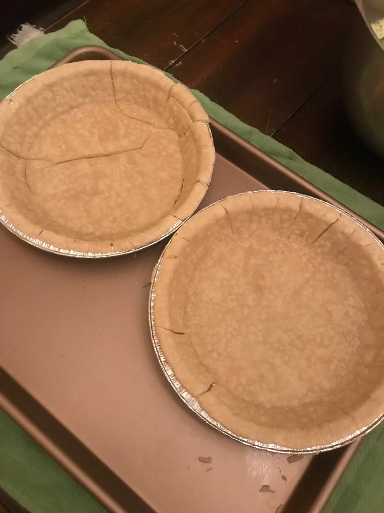 Image of Bake both gluten-free pie crusts for 10 minutes. Remove from oven and let sit until ready with quiche ingredients. Keep oven on at 375 degrees. The crusts might split, like one of ours did. It’s OK and will be good...
