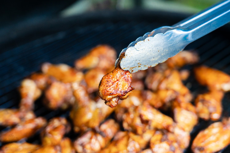 Image of Smoke wings turning every 30 minutes until they are cooked through. About an hour to 1.5 hours and remove. 