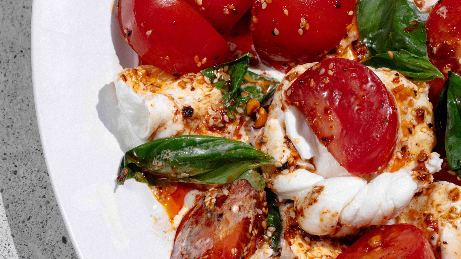 Burratta and chilli oil with lush fresh tomato. 