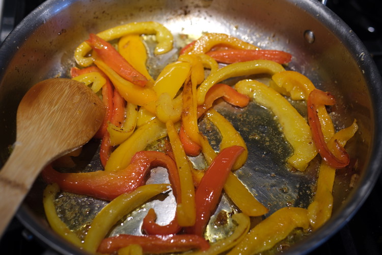 Image of Let the peppers cook, stirring occasionally, until soft and cooked (but not sauce!)