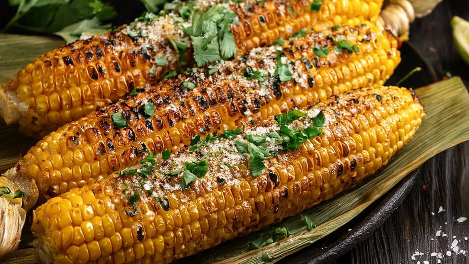 Grilled Corn on the Cob with Elote Seasoning with lemons and cilantro