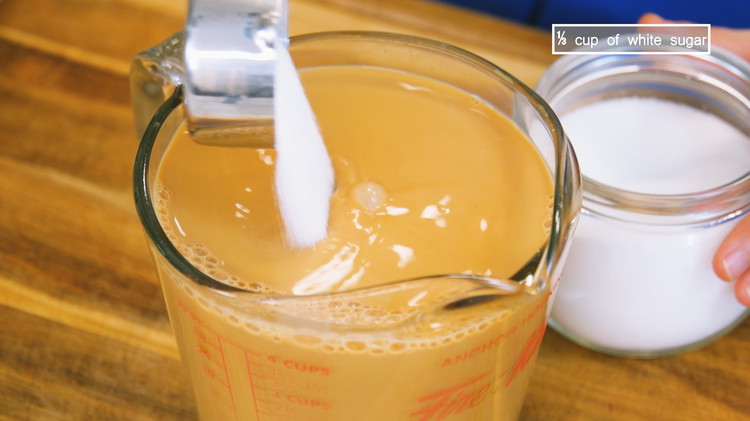 Image of Stir in 1/3 cup of sugar or to taste and you just made a perfect silk-stocking milk tea, or what we call 丝袜奶茶, Yes, it is named after the sock-looking filter tool. You can enjoy it as is.