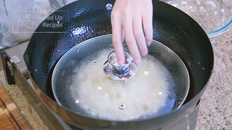 Image of Put on the lid and cook the onions on the lowest heat until soft, about 5 minutes.