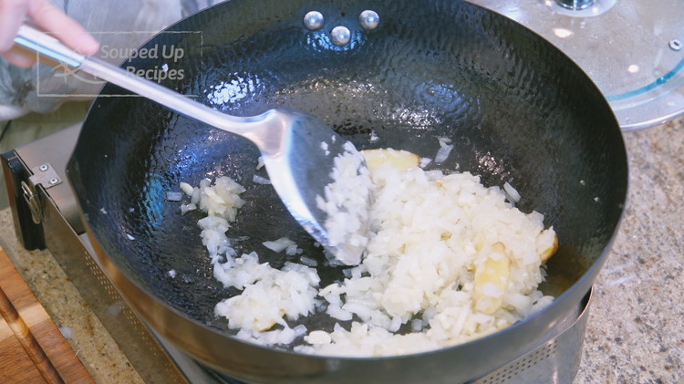 Image of Remove the onions from the stove and set it aside. Chef’s Secret: Cantonese-style roasted duck is unique with onion soup inside, making it juicy and perfect for dipping over rice. The key to creating the onion soup is to sauté...