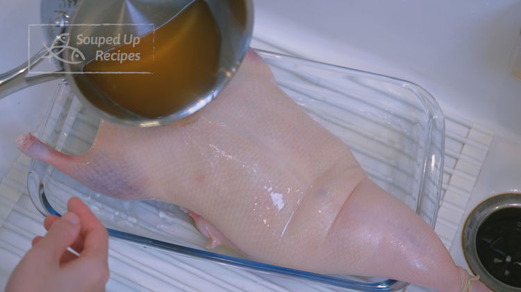 Image of Put the duck in a clean tray. Pour the crispy...