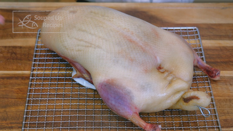 Image of Place the duck onto a rack in a dehydrator; set the temperature to the lowest and dehydrate for 6 hours or until the skin becomes dry like plastic. If you don't have a dehydrator, place the duck on a rack...