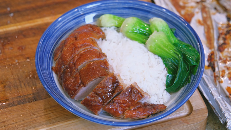 Image of Carve the duck and serve with white rice and blanched vegetables.
