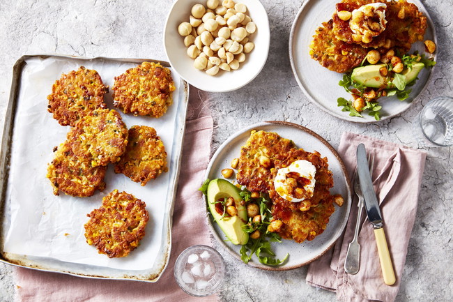 macadamia corn fritters topped with avocado and sour cheese