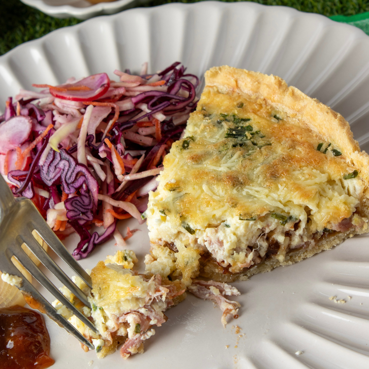 Image of Serve slices of quiche with a side of pickled slaw, pickled
onions and some extra Tiptree Ploughman’s Chutney to taste.
