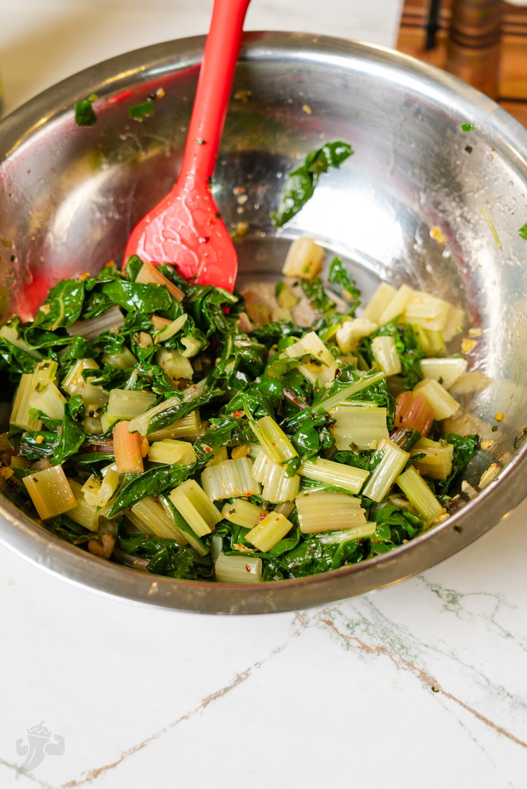 Image of Once the oil is done, the garlic should be light brown and toasty and the smell should be amazing, combine the oil and the drained chard in a mixing bowl, add a pinch of salt and stir to combine. You’re...