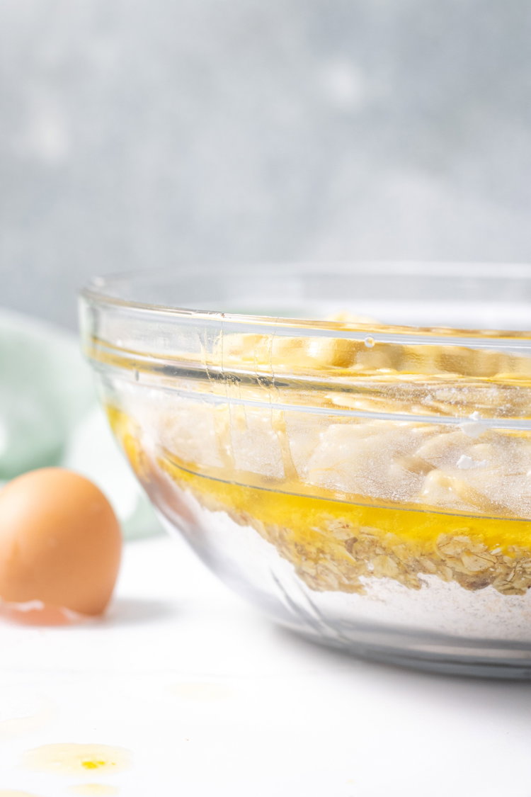 Image of Blend together oil, egg , banana and sugar.