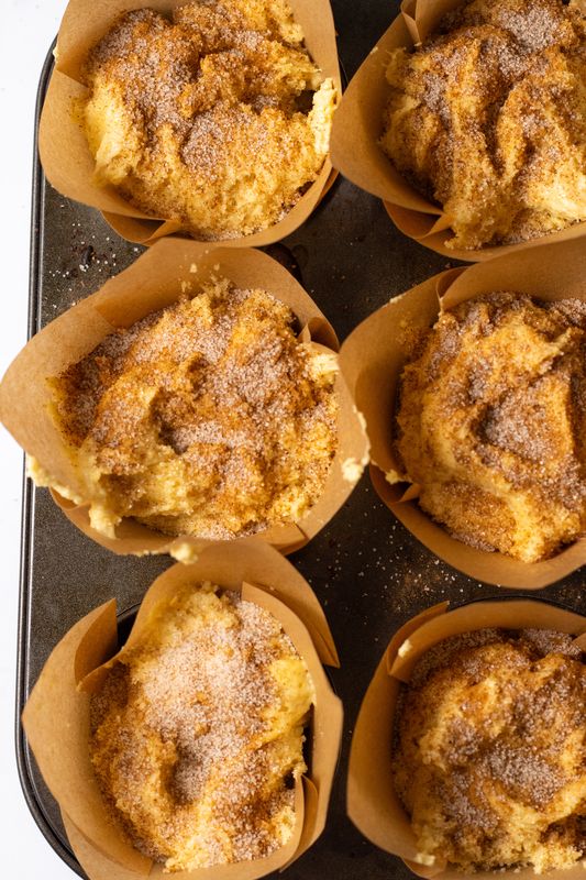 Image of Spoon batter into lined muffin tins.