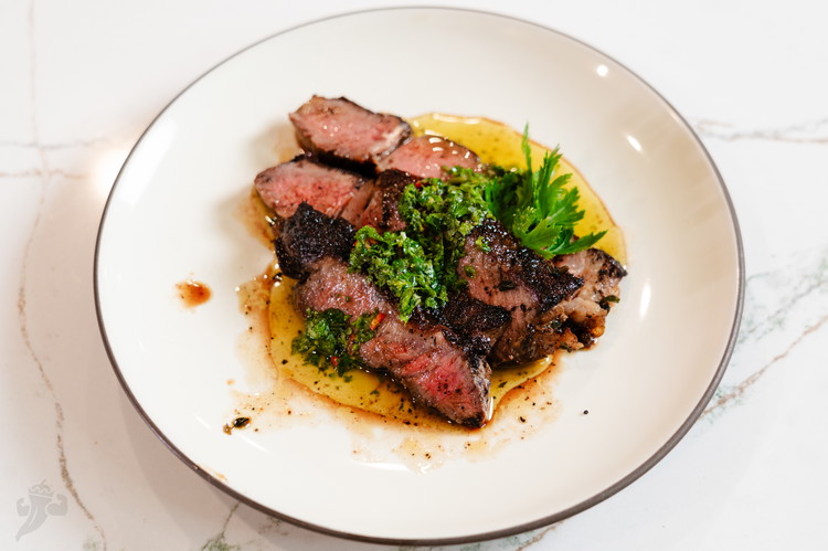 Image of Slice and serve either on its own with some of those juices that have collected in the foil or with some chimichurri or herby garlic butter.
