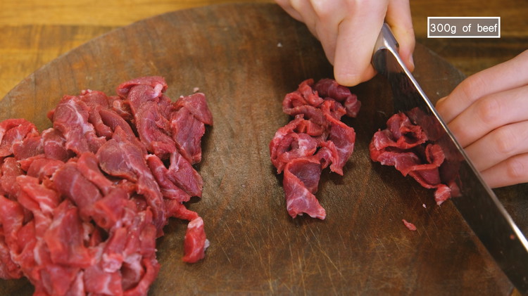 Image of Slice the beef into thin pieces. Recommend using top blade, flank steak, ribeye, and sirloin. 
