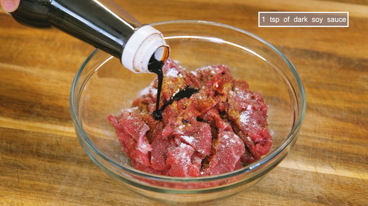 Image of Marinate the beef with 1/4 tsp of salt, 1/4 tsp of garlic powder, 1/4 tsp of ground black pepper, 1/4 tsp of baking soda to tenderize the meat, 2 tsp of soy sauce, and 1 tsp of dark soy sauce....