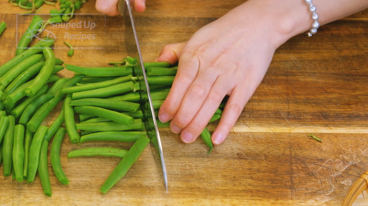 Image of Simply trim off the tips of the green beans and cut them in half.