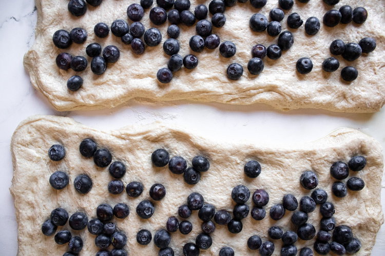 Image of Place on parchment paper , add berries and cream cheese.